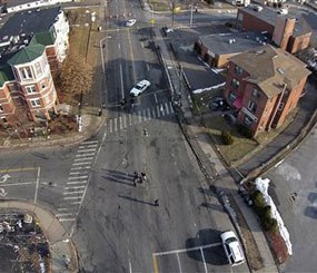 This Feb. 1, 2014 photo, taken by a camera mounted on a drone aircraft and provided by Pedro Rivera, shows an auto that crashed into a building in Hartford, Conn. (AP Image)