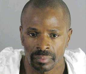 Earl Ellis Green, 46, a parolee with a history of violent crimes, is accused of slaying Riverside police officer Ryan Bonaminio.