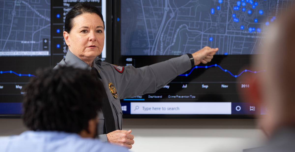 police chief leading a meeting using a crime map