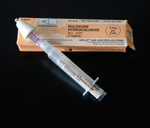 A nasal-administered dose of naloxone.
