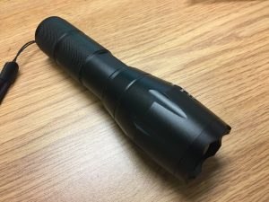 Flashlight with window breaker