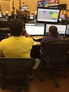 Amanda Maddox, TERT dispatcher from Henry County, GA, receiving training in local procedures from a Collier County (FL) dispatcher during the Hurricane Irma TERT deployment.