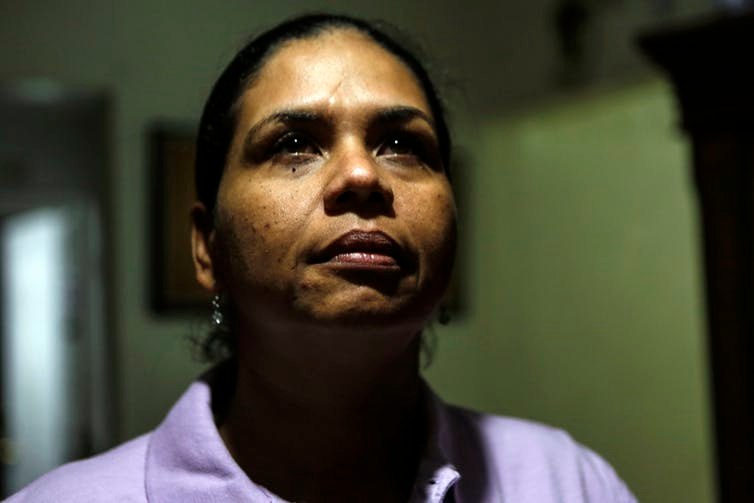 After being stabbed nearly to death, Wanda Gomez was advised by authorities in her Florida community to quit her job and leave her home. She lost her ability to make a living and provide a safe living environment for her family. Image: AP/Ellis Rua