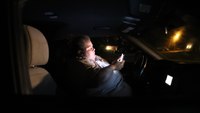 In a Theme Park Parking Lot at Night, a Worker Sleeps in Her Car. This Is Life in America's Most Visited City