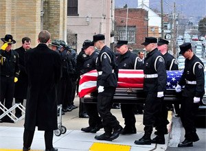 Corrections officers carry the casket of fellow Officer Eric Williams into Holy Trinity Church in Nanticoke, Pa. (AP Photo/The Times Leader, Aimee Dilger, File)
