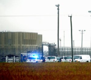 In this Oct. 12, 2017, file photo, police vehicles are seen outside Pasquotank Correctional Institution in Elizabeth City, N.C.