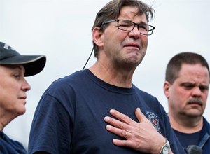 Darrington Fire District 24 volunteer firefighters, Jan McClelland, left, Jeff McClelland, center, and Eric Finzimer, first responders to the massive mudslide talk to the media about their experiences as rescue workers. (AP Photo/The Seattle Times, Marcus Yam)