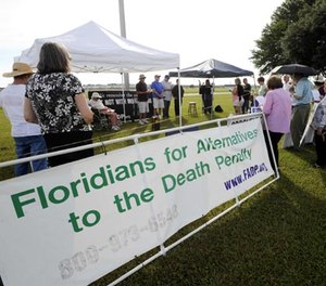 Protesters against the death penalty demonstrate in front of the Florida State Prison near Starke, Fla., Thursday, July 10, 2014. (AP Photo/Phil Sandlin)