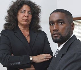 Albert Florence, right, sits at his home Bordentown, N.J., with his attorney Susan Chana Lask. In a 5-4 decision, the Supreme Court ruled against Florence, who faced strip searches in two county jails following his arrest on a warrant for an unpaid fine that he had, in reality, paid.