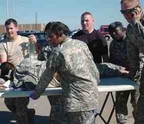 This Thursday, Nov. 5. 2009 photo released by the Defense Department shows first responders using a table as a stretcher to transport a wounded Soldier to an awaiting ambulance at Fort Hood, Texas. (AP Photo/Defense Department, Sgt. Jason R. Krawczyk)