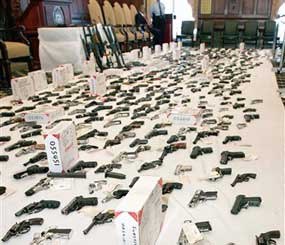 Hundreds of weapons confiscated by Philadelphia police are shown on display.