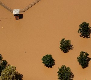 The guard tower at a Texas State prison unit is submerged by water from the flooded Brazos River in the aftermath of Hurricane Harvey Friday, Sept. 1, 2017, in Rosharon, Texas (AP Photo/Charlie Riedel)