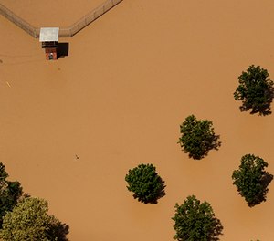The guard tower at a Texas State prison unit is submerged by water from the flooded Brazos River in the aftermath of Hurricane Harvey Friday, Sept. 1, 2017, in Rosharon, Texas