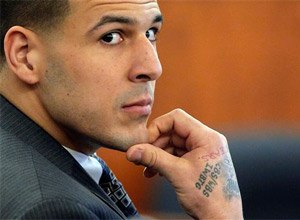 Former New England Patriots NFL football player Aaron Hernandez listens as prosecution witness Alexander Bradley testifies during his murder trial, at Bristol County Superior Court in Fall River, Mass. (AP Photo/Brian Snyder, Pool, File)
