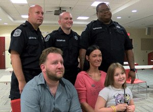 Amber Lloyd sits with her family and the three correctional officers who saved her life. (Photo ABC News)