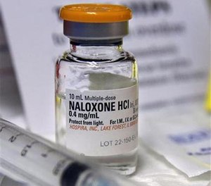 In this Wednesday, Feb. 19, 2014, file photograph, a small bottle of the opiate overdose treatment drug, naloxone, also known by its brand name Narcan, is displayed at the South Jersey AIDS Alliance in Atlantic City, N.J.