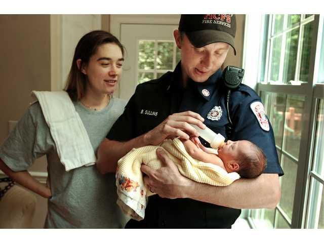 emt holding baby