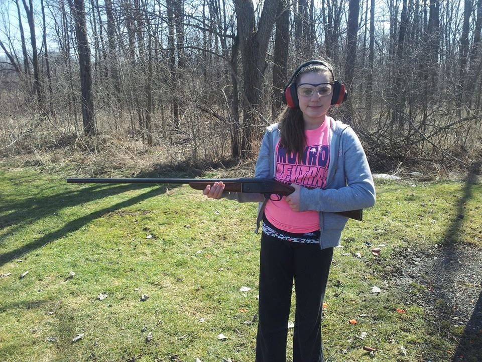 girl holding gun