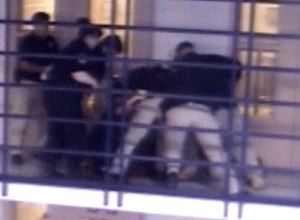 A group of jail guards restrain an inmate at the Metropolitan Detention Center on Monday in an incident that is now being investigated.