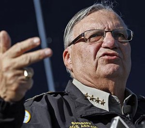In this Jan. 9, 2013, file photo, Maricopa County Sheriff Joe Arpaio speaks to reporters in Phoenix, Ariz. Arpaio's lawyers want a federal judge to recuse himself from all future proceedings in a racial-profiling case. (AP File Photo/Ross D. Franklin)

