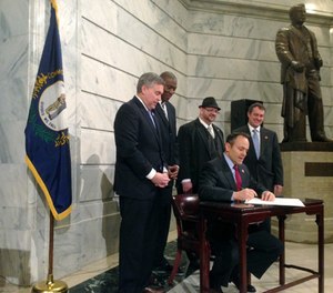 Kentucky Gov. Matt Bevin signs an executive order aimed at giving people with criminal records a 