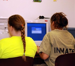 Women inmates study on computers Thursday, Nov. 15, 2007 at the South Dakota women's prison in Pierre, S.D.