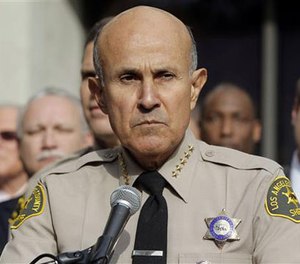 In this Jan. 7, 2014, file photo, then-Los Angeles County Sheriff Lee Baca announces his retirement at a news conference at Sheriff's Headquarters Bureau in Monterey Park, Calif. (AP Image)