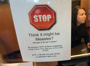 A sign warns of the dangers of measles in the reception area of a pediatrician's office in Scottsdale, Ariz., Saturday, Feb. 7, 2015. Health officials in the state continue to see cases of the disease which had been eradicated in the U.S.