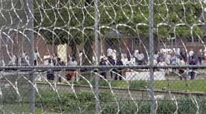 Inmates at the Lakeland Correctional Facility in Coldwater, Mich., mill about the yard on June 1, 2007. (AP photo)