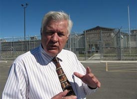 Albert Peterson with the Two Rivers Authority stands outside an empty jail that Hardin, Mont. built for $27 million. (AP Photo/Matthew Brown)