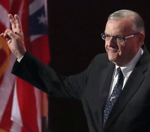In this July 21, 2016, file photo, Sheriff Joe Arpaio of Arizona walks on the stage to speak during the final day of the Republican National Convention in Cleveland.