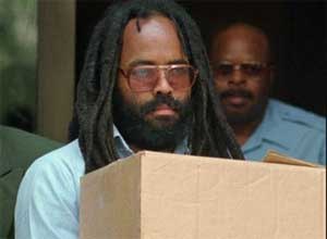 In this July 12, 1995 file photos, convicted police killer and death-row activist Mumia Abu-Jamal leaves Philadelphia's City Hall after a hearing. (AP Photo/Chris Gardner, File)