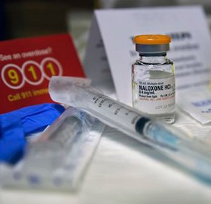 A kit with naloxone, also known by its brand name Narcan, is displayed at the South Jersey AIDS Alliance in Atlantic City, N.J. on Wednesday, Feb. 19, 2014. An overdose of opiates essentially makes the body forget to breathe. Naloxone works by blocking the brain receptors that opiates latch onto and helping the body