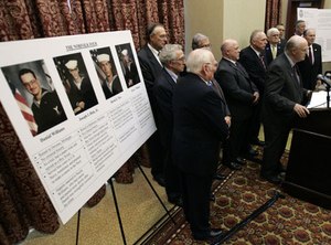 Retired FBI agent Jay Cochran, at podium, speaks during a news conference on the murder convictions of the Norfolk Four in Richmond, Va., Monday, Nov. 10, 2008. (AP Photo/Steve Helber)