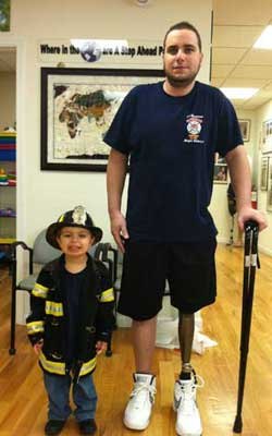 Photos Ralph Lettieri
Lettieri stands with a cane for the first time with his son.