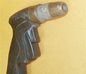 This image released by the Long Beach Police shows the black pistol grip water hose nozzle held by Doug Zerby before being shot to death by Long Beach Police officers on Sunday afternoon.