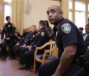 Former Oakland Police Chief Anthony Batts moves out of his chair during a news conference with Oakland Mayor Jean Quan and new Oakland interim police chief Howard Jordan at Oakland City Hall in Oakland, Calif., Thursday, Oct. 13, 2011. Batts resigned on Tuesday and was replaced by Jordan. (AP Image)