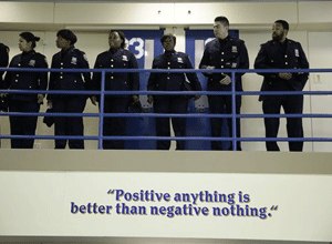 Corrections officers wait for the start of a news conference in an enhanced supervision housing unit on Rikers Island in New York, Thursday, March 12, 2015.