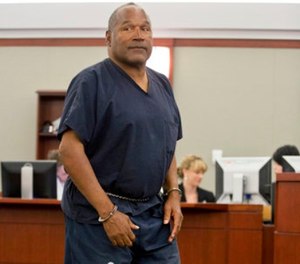 In this May 15, 2013 file photo, O.J. Simpson returns to the witness stand to testify after a break during an evidentiary hearing in Clark County District Court in Las Vegas. (AP Photo/Julie Jacobson, Pool, file)