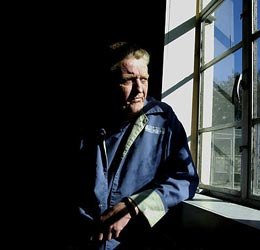 Dennis Whitney looks out a window during an interview room at Union Correctional Facility in Raiford, Fla. Whitney has been incarcerated for more than 44 years. (AP Photo/Oscar Sosa)