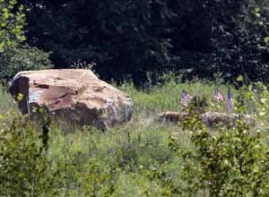 AP Photo/Gene J. PuskarThis is the 17-ton boulder, left, that was placed to mark the site of the crash of Flight 93 at the Flight 93 memorial in Shanksville, Pa., Monday, Aug. 1, 2011.