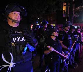 Police officers from various agencies prepare for riots in Pittsburgh. (AP Photo)
