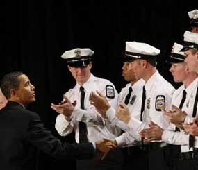 In this March 6, 2009 file photo, President Barack Obama greets officers at the Columbus Police Graduation Exercises in Columbus, Ohio. The nation's police departments are clamoring for an unprecedented amount of federal aid to forestall big local tax hikes or the possible layoff of nearly 40,000 police officers - enough to staff the entire New York City Police Department. (AP Photo)