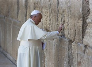 Pope Francis prays in front of the Western Wall, in Jerusalem's Old City, Monday, May 26, 2014. (AP Photo/Oded Balilty)