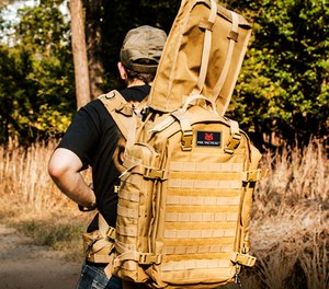 A well designed pack that allows a user to safely transport a rifle or shotgun in the field.