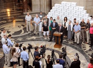 Death penalty supporters stand in front of boxes they say contain 166,692 petition signatures, enough to block the repeal of the death penalty in Nebraska until voters decide the issue, during a news conference Wednesday, Aug. 26, 2015 at the state capitol in Lincoln, Neb. (Eric Gregory/The Journal-Star via AP)