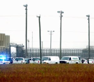 In this Thursday, Oct. 12, 2017 photo, police vehicles are seen outside Pasquotank Correctional Institution in Elizabeth City, N.C.