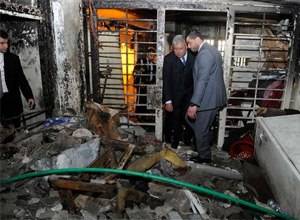 In this photo released on Tuesday, Jan. 13, 2015, by Lebanon's official government photographer Dalati Nohra, Lebanese Interior Minister Nohad Machnouk, center left, checks a damaged cell of Roumieh prison's Block B after a raid by the Lebanese security forces, who then moved militant prisoners to other cells in Roumieh, east of Beirut, Lebanon. (AP Photo/Dalati Nohra)
