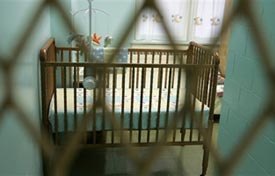 A crib sits in the cell of an inmate housed in the Wee Ones Nursery unit at the Indiana Women's Prison in Indianapolis. (AP photo)