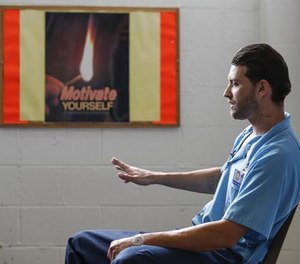 In this Oct. 17, 2016 photo, inmate Joshua Meador speaks about addiction at Sheridan Correctional Center in Sheridan, Ill. Meador, a recovering heroin addict, hopes to get into a Vivitrol program at Sheridan before his release in January. U.S. prisons are experimenting with the high-priced monthly injection that could help addicted inmates stay off opioids after they are released.